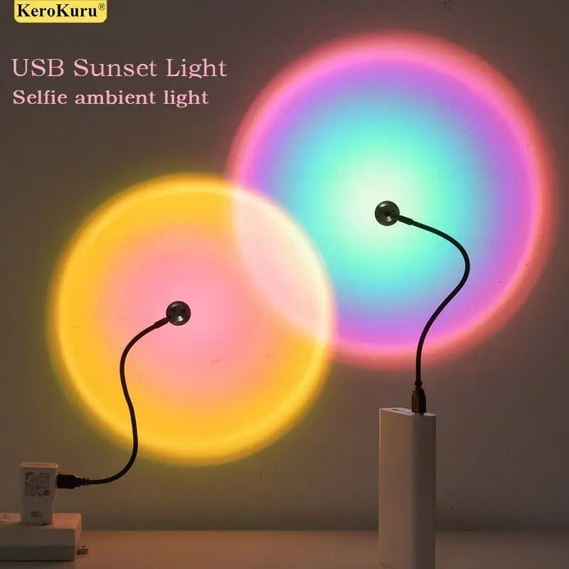 USB sunset projection lamps with flexible black necks casting circular yellow and rainbow ambient light on a wall.