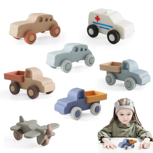 Set of multi-colored silicone baby teething toy cars and airplane for sensory play.