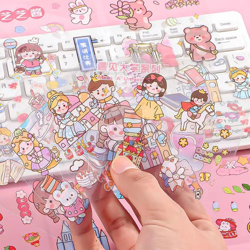Sheet of pastel cute character stickers, hand holding small sticker pieces