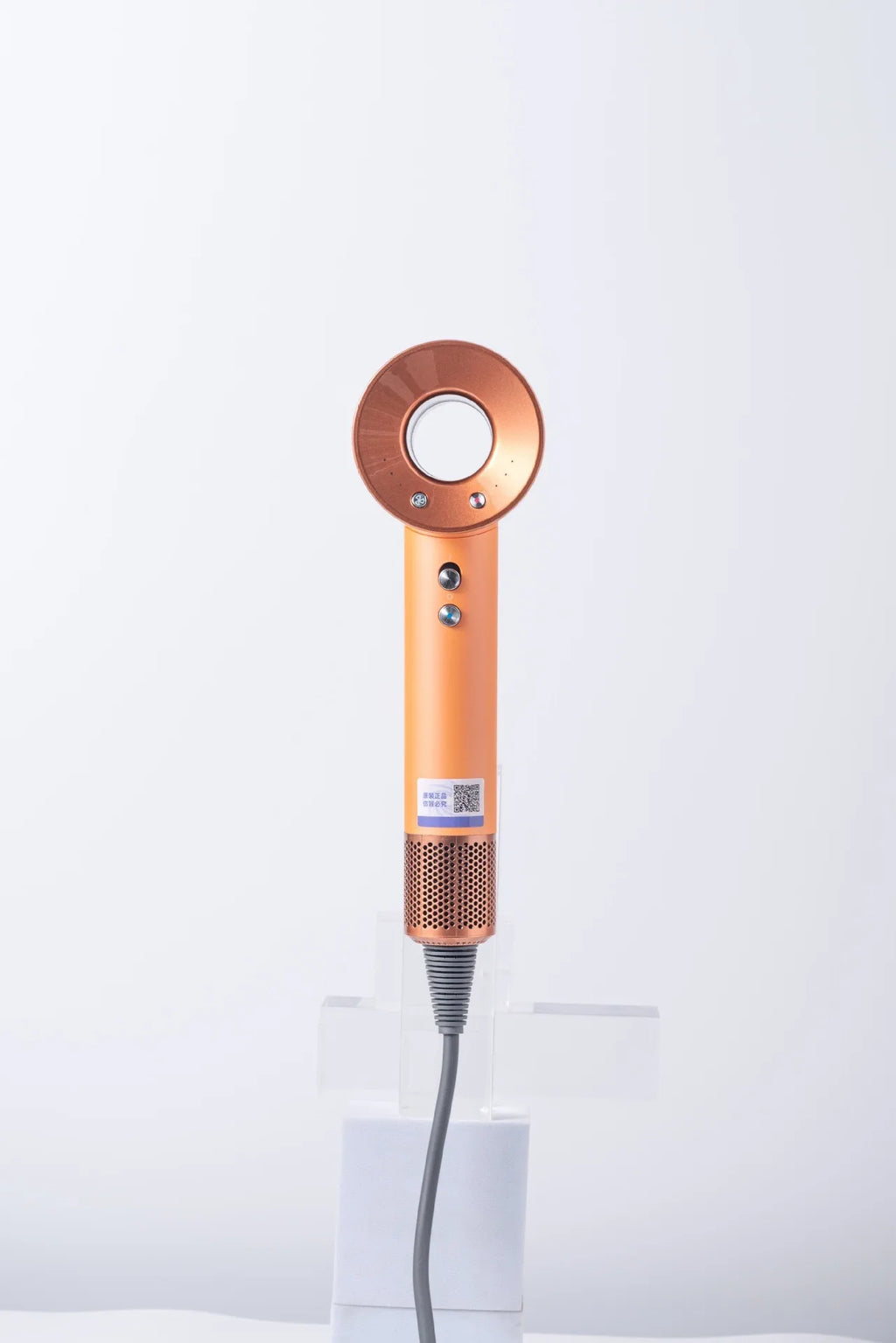 Orange high-speed negative ion bladeless hair dryer with hollow design and magnetic attachments for fast drying.