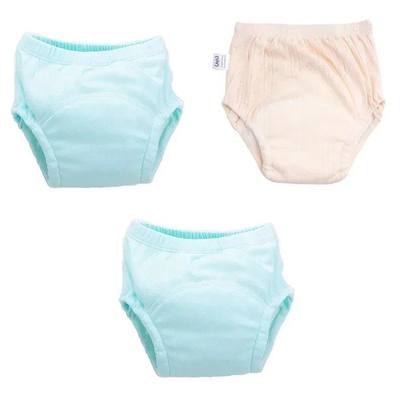 Three-pack of baby cotton training pants in pastel blue and pink for potty training.