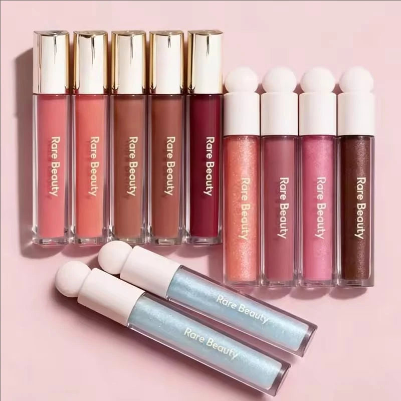 Rare Beauty Soft Pinch tinted lip oils and lip glosses in a range of pigmented, moisturizing, and shimmering shades.