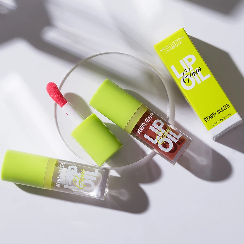 Beauty Glazed moisturizing lip oil set with applicator, featuring lustrous, candy-tinted mirror shine lip gloss tubes.