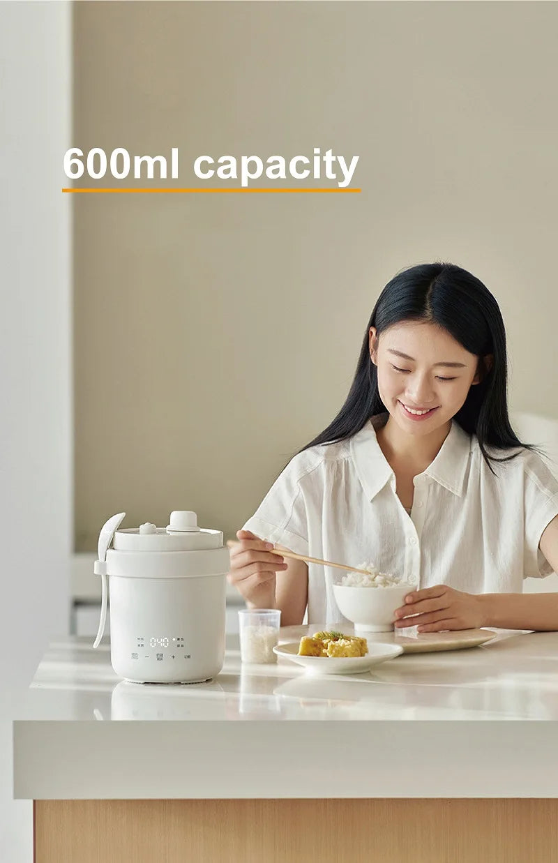 White mini electric rice cooker with lid and side handle, 600ml capacity