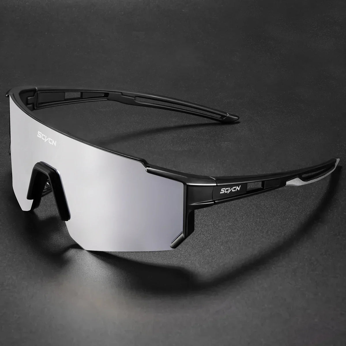 Black cycling sunglasses with white-tinted lens and wraparound sports frame