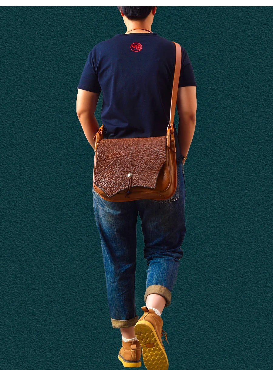 PNDME vintage handmade brown cowhide messenger bag, genuine leather with textured flap for travel. Designer handbag.