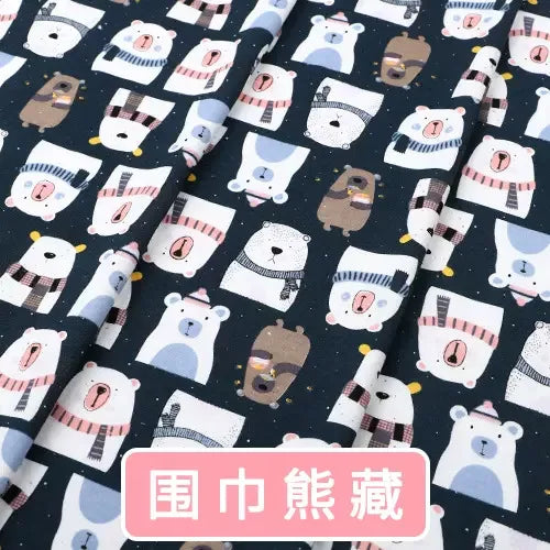 Navy blue knit jersey fabric with a repeating print of cute polar bears wearing scarves, ideal for baby clothing.