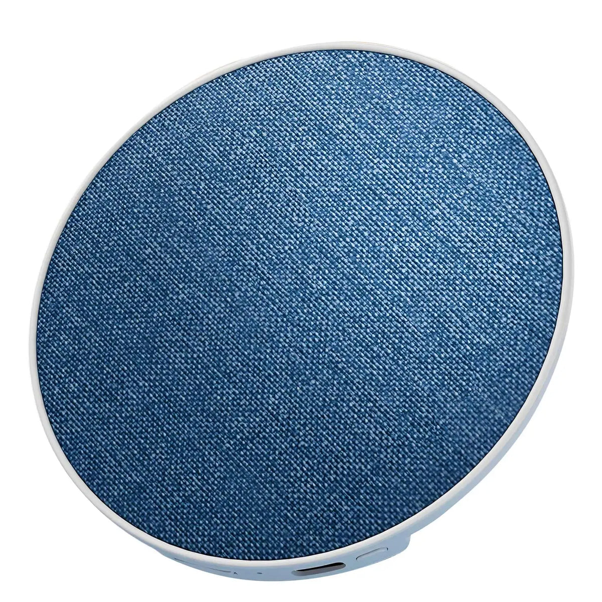 Blue circular fabric face of under-pillow speaker with white edge trim