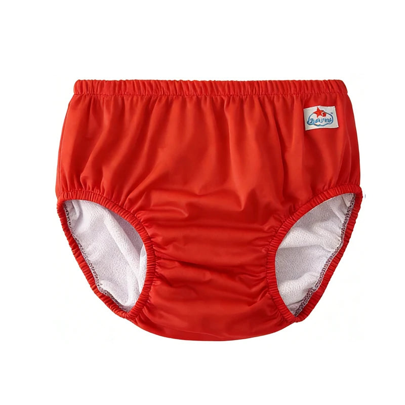 Red reusable cloth baby training diaper with soft interior lining and branded logo tab.