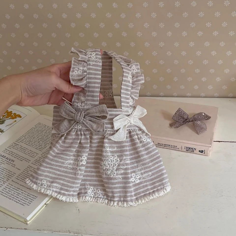 Cute beige striped dog dress with bows and floral embroidery for small to medium pets. Perfect spring summer pet outfit.