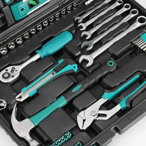 Close-up of teal-and-silver hand tools, sockets, and bits in black tool tray