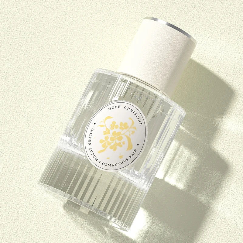 Hope Christine Golden Osmanthus Rain: Women’s floral 50ml perfume in a ribbed glass bottle with a cream cap.