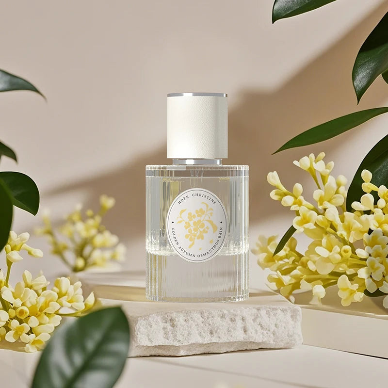 Hope Christine Golden Osmanthus Rain: Women’s 50ml floral perfume in a ribbed glass bottle with a white cap.