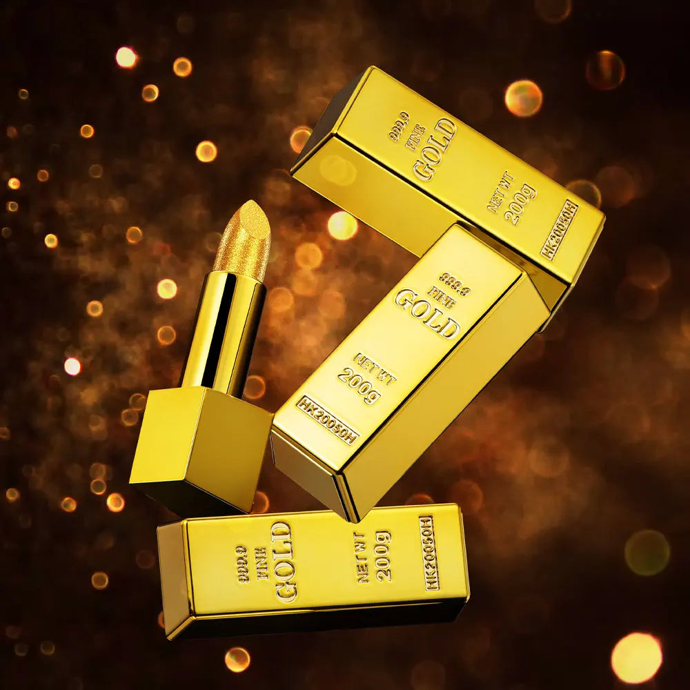 Shimmer gold glitter lipstick in a luxury metallic gold brick tube against a glowing bokeh background.