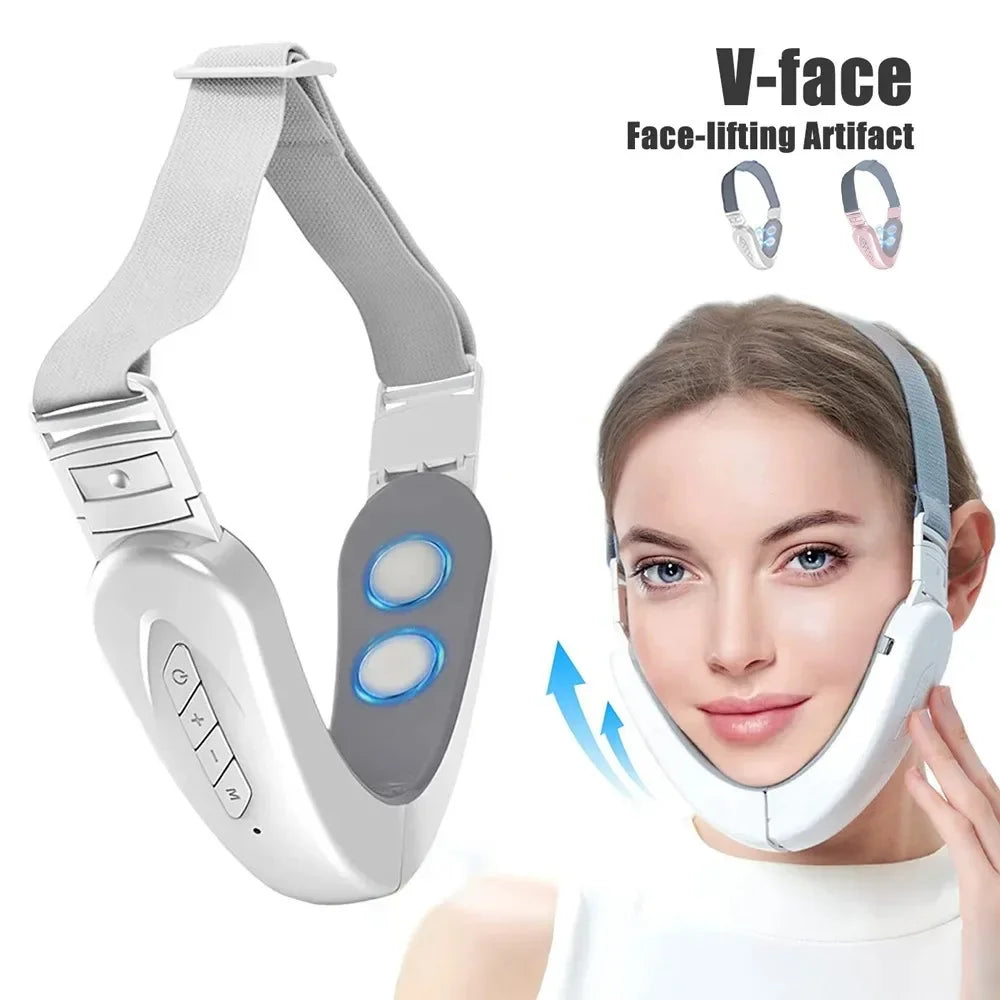 White electric V-face lifting massager with an adjustable elastic strap, worn by a woman to firm her jawline.