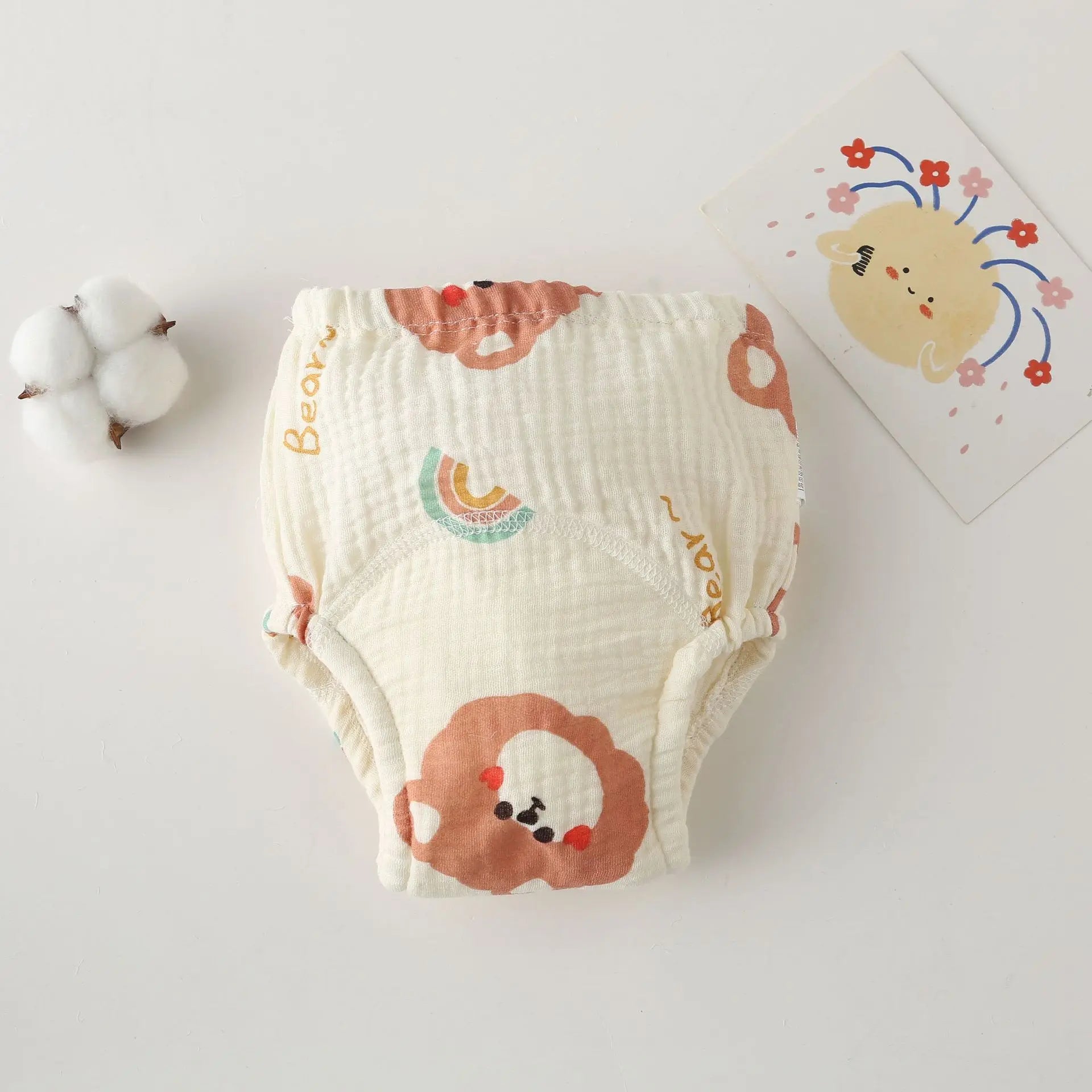 Baby care training diaper in soft muslin cotton with cute bear and rainbow print.