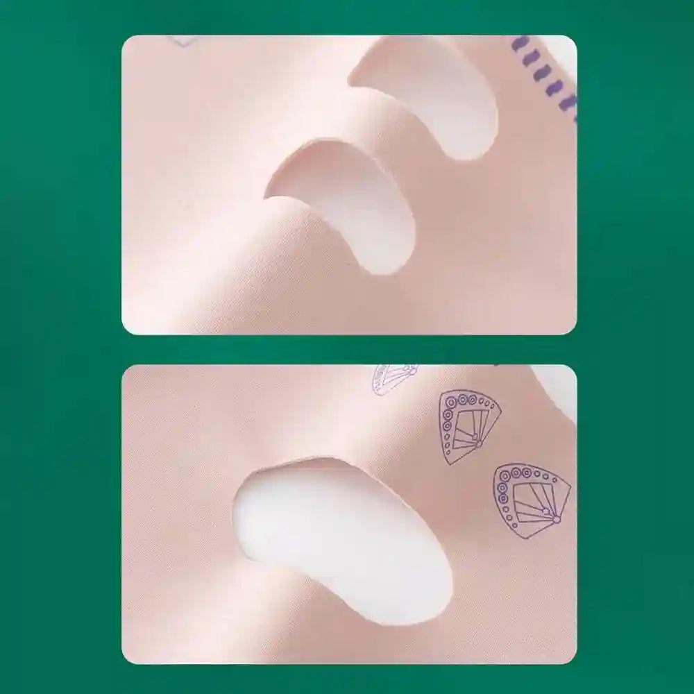 Close-up of a smooth, pale pink V-line lifting mask with ear cutouts and small purple fan patterns on the fabric.