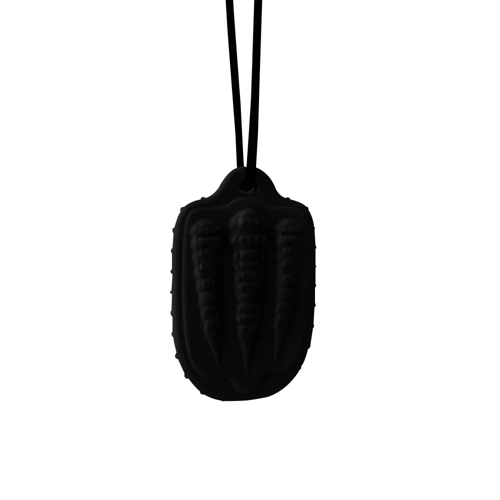 Black silicone baby teething toy on a cord for soothing infant gums.