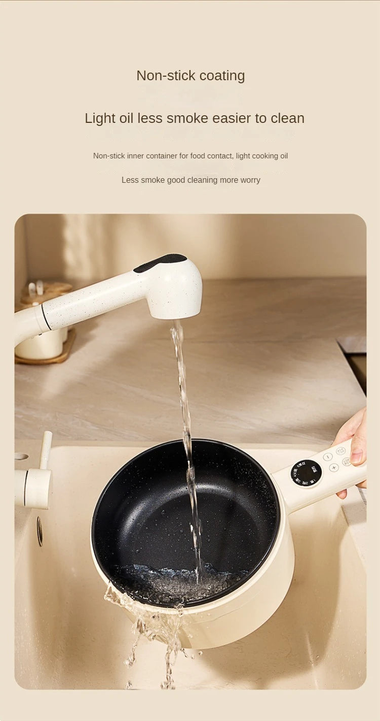 Electric non-stick inner hot pot with water pouring into black cooking bowl