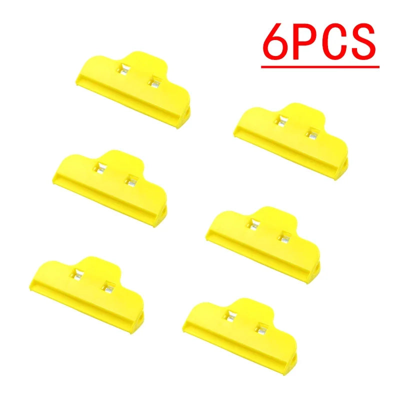 Six yellow Tidesmit plastic spring clamps for mobile device screen repair, shown in a grid on a white background.