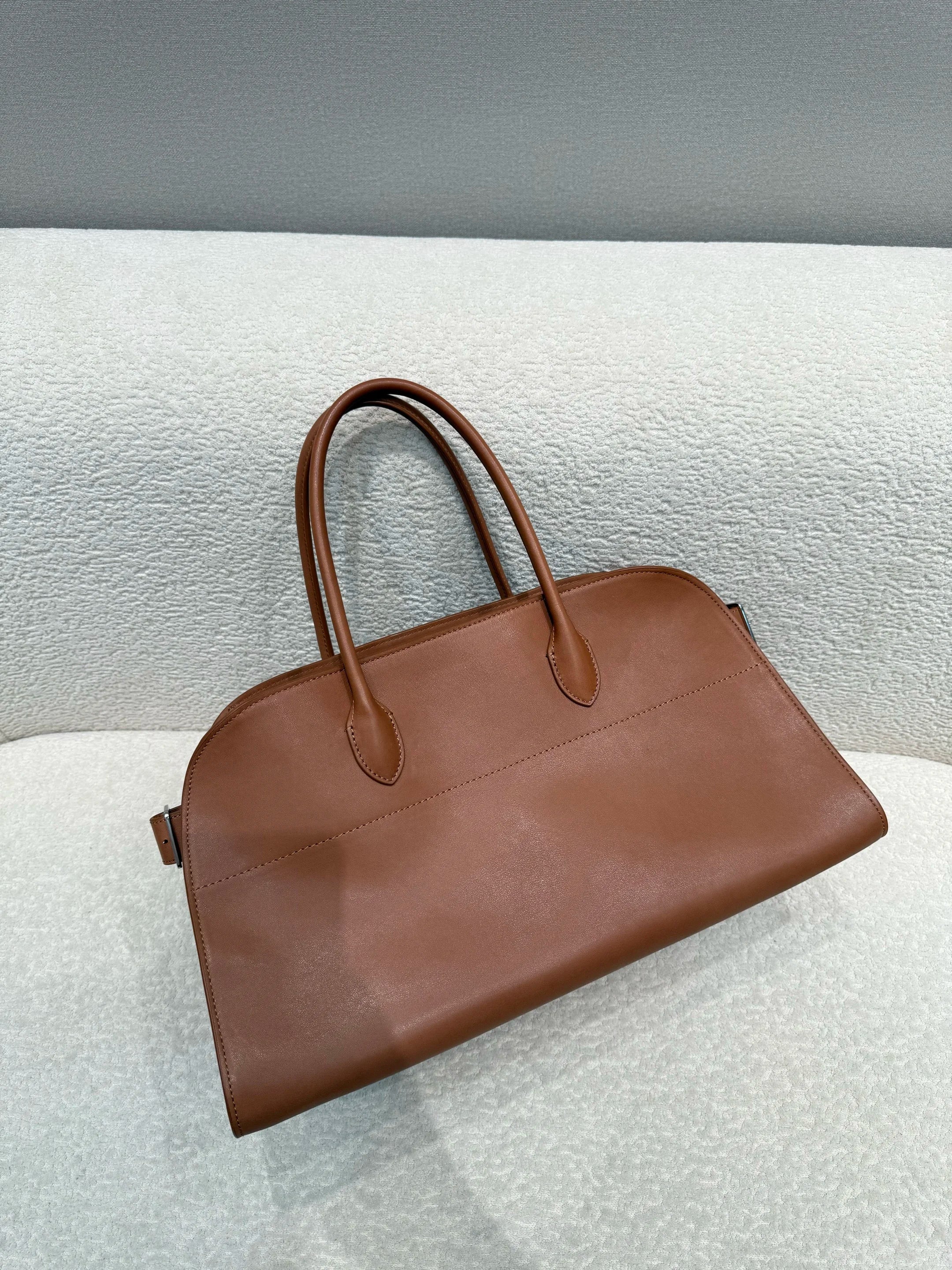 Unisex saddle leather all steel hardware inner sheepskin single shoulder large capacity hand-held horizontal bag