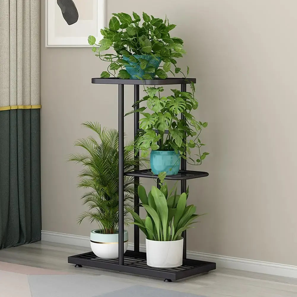 Multi-layer plant display shelf with black frame and round tiers, holding several potted plants