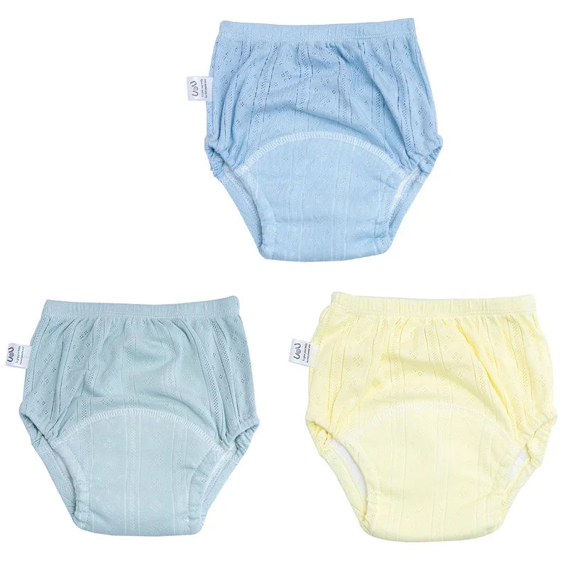 Three-pack of baby potty training diaper underwear in blue, teal, and yellow with breathable knit texture.