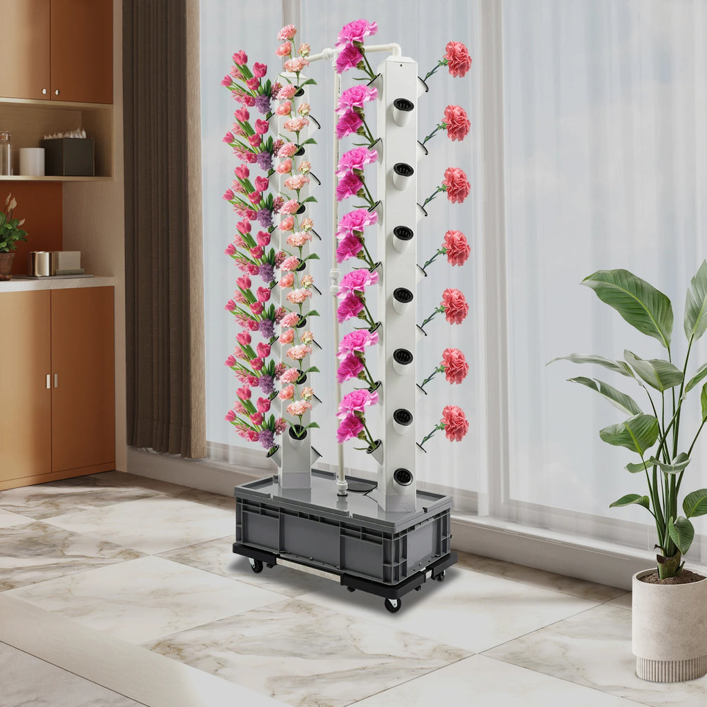 Hydroponic growing tower with pink flower plants in white columns, black wheeled base
