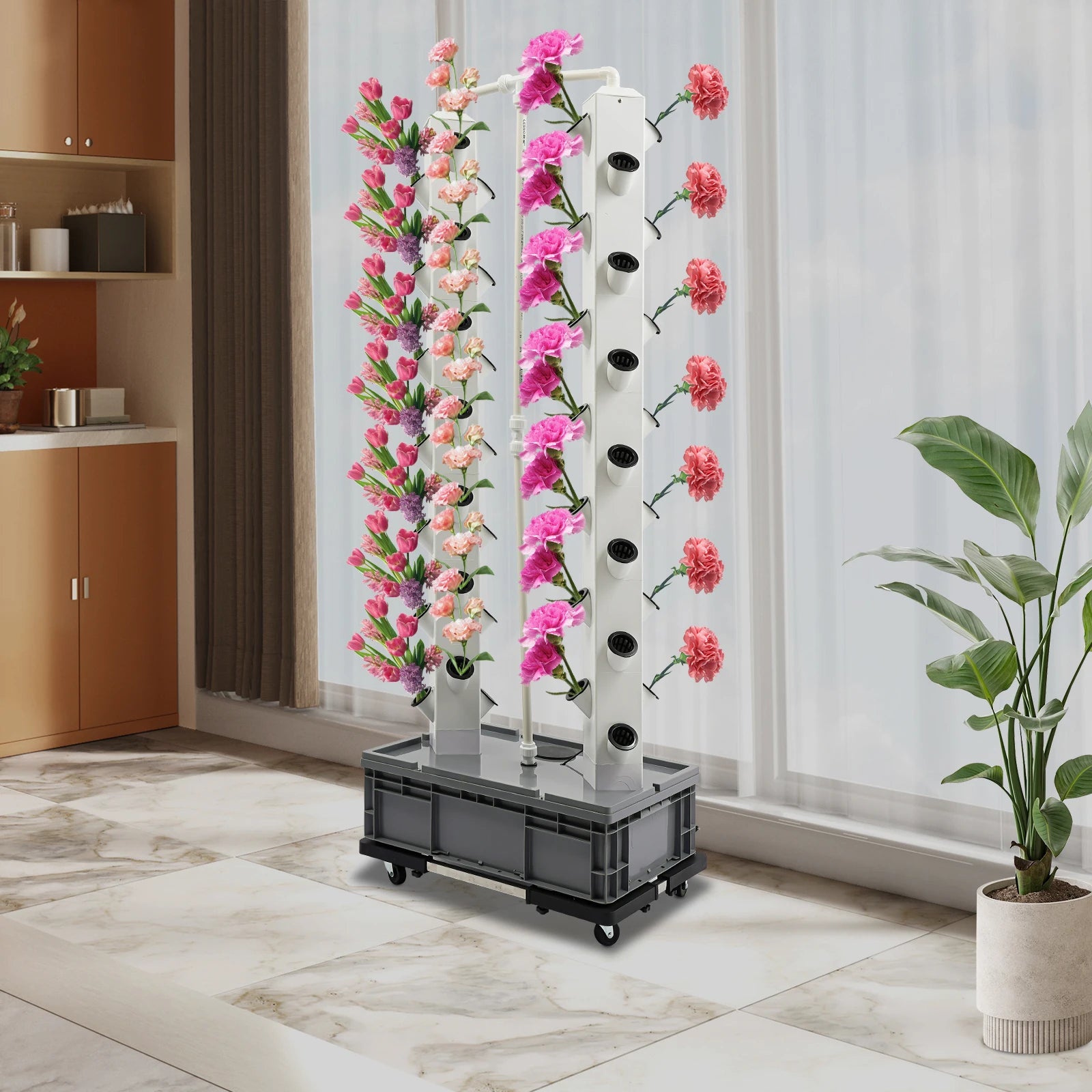 Hydroponic growing tower with pink flower plants in white columns, black wheeled base