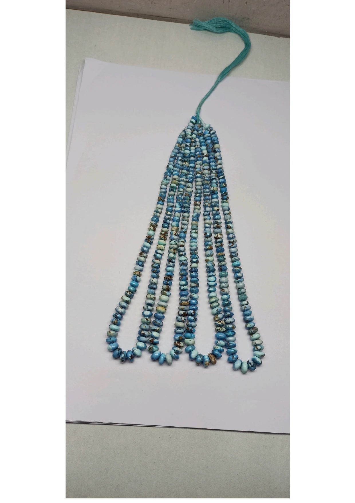 Turquoise rondelle bead strand with hanging tassel, smooth round beads, loose string