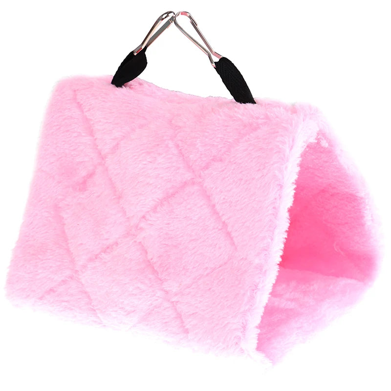 Cozy pink plush hanging hammock bed for hamsters, rats, and birds. Soft winter nest for small pet cage comfort.