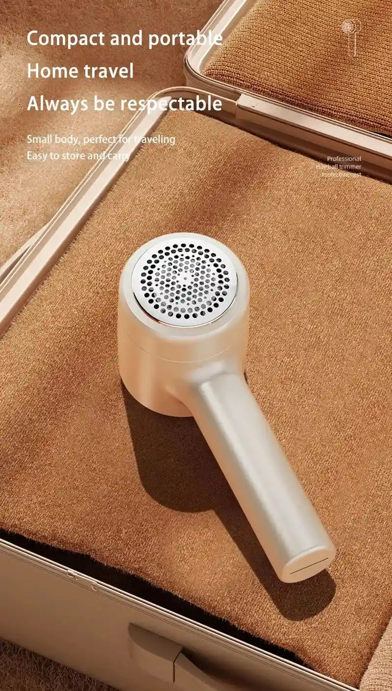 Tidesmit rechargeable fabric shaver removing lint and hair balls from clothes, side view showing shaver head detail.