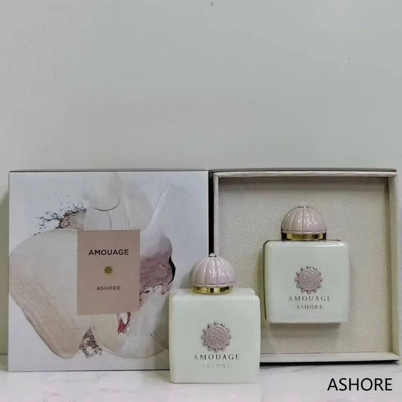 Amouage Ashore 100ml Eau de Parfum. Creamy white square bottle, pink dome cap, elegant floral fragrance gift set.