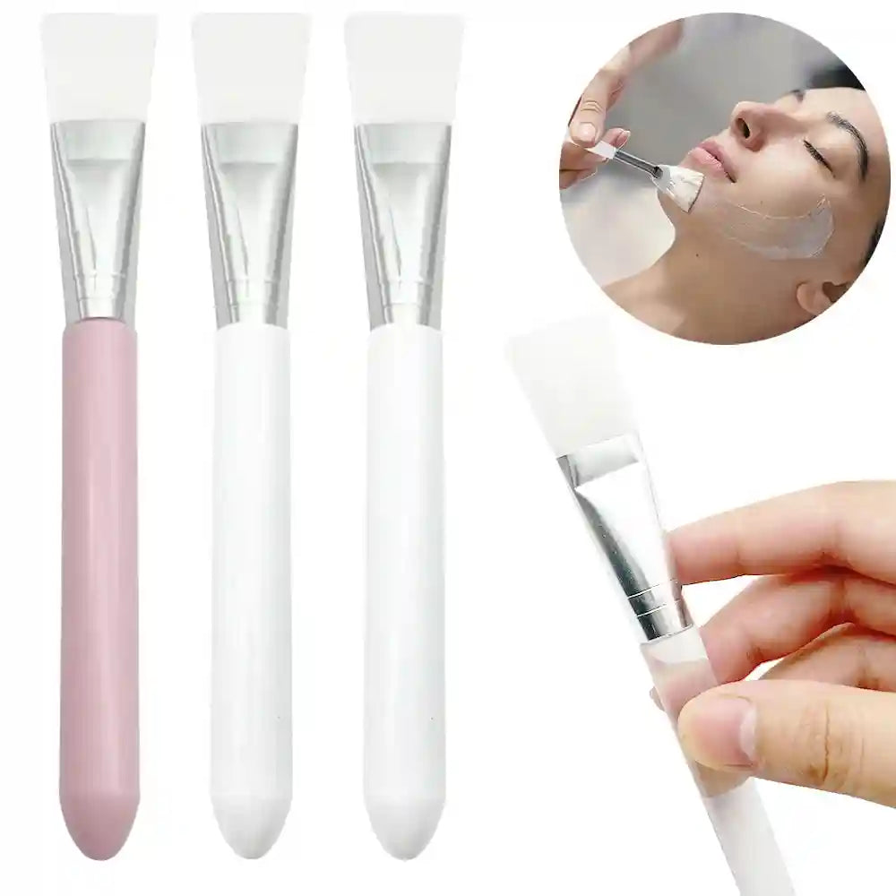 Silicone facial mask brushes with white flat heads, silver ferrules, and pink or white plastic handles.