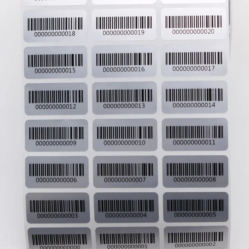 Grid of barcode inventory stickers with black bars and zero-padded digits on white.