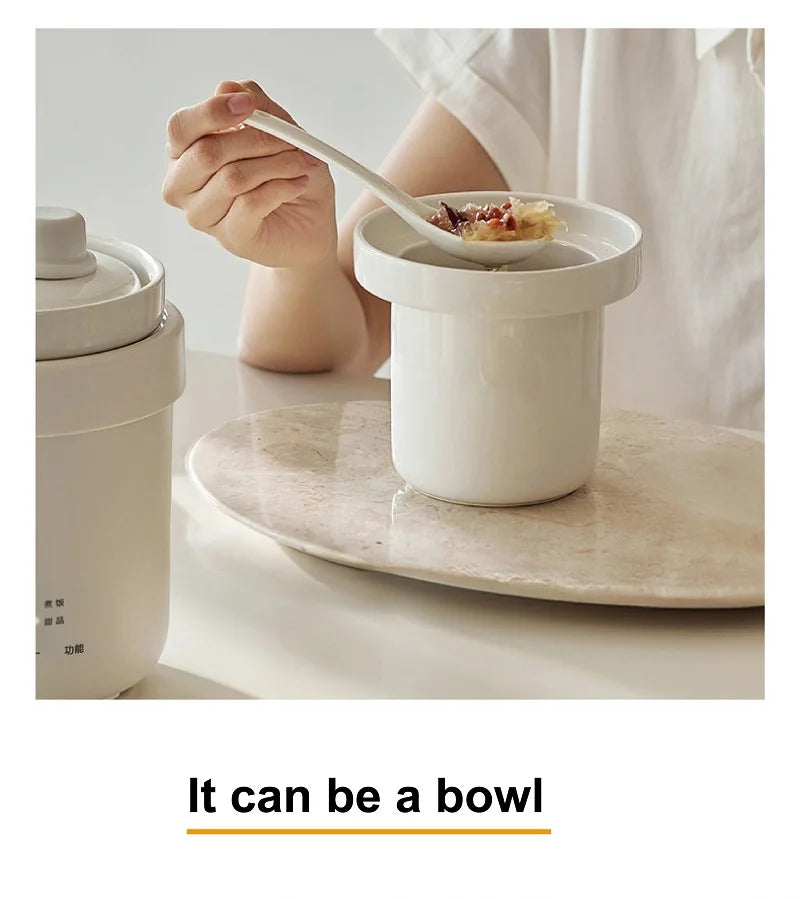 White electric stew pot with ladle serving, showing food scooped from the pot