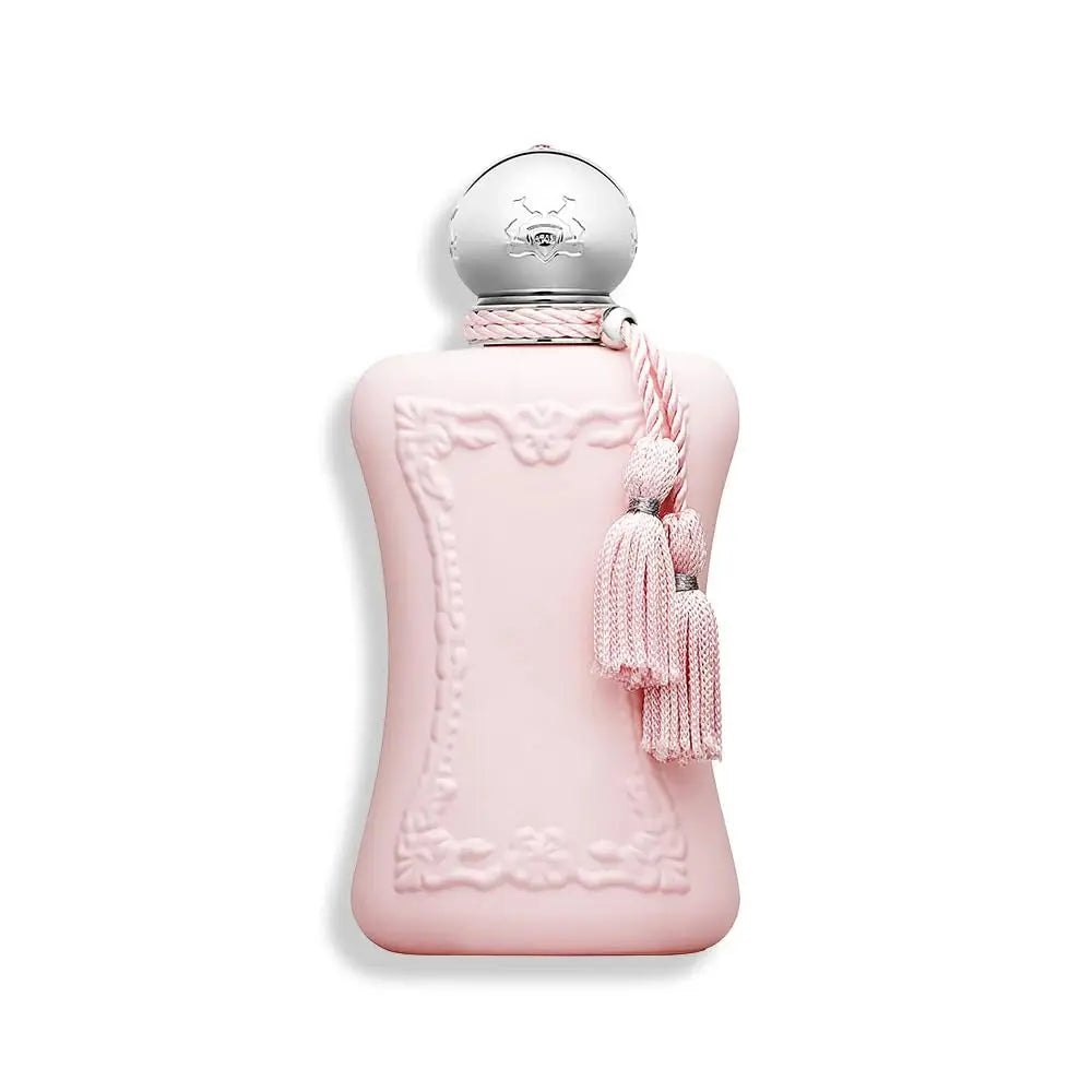 Delina perfume in a pale pink glass bottle with an embossed frame, silver cap, and matching decorative pink tassels.