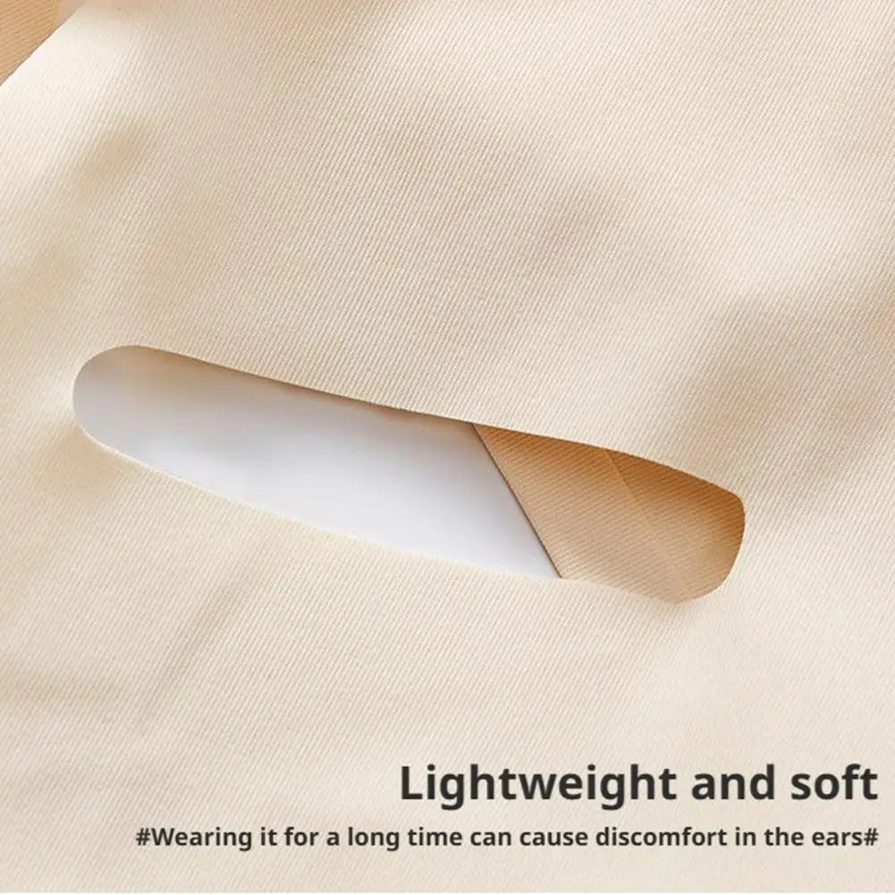 Beige, soft fabric face-slimming bandage with a cutout for ear placement, shown in a close-up detail shot.