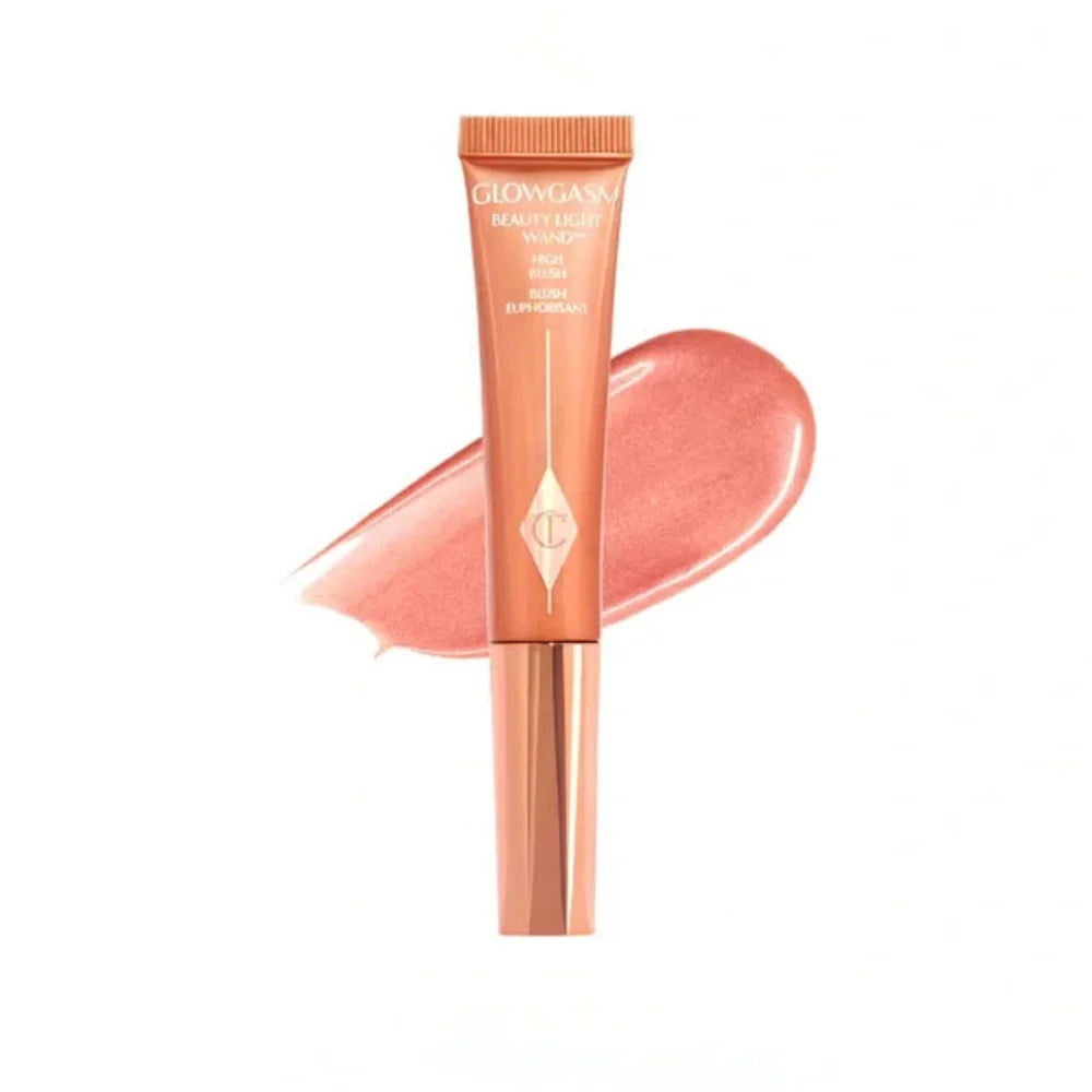 Charlotte Tilbury Glowgasm Beauty Light Wand liquid blush in peach with shimmering texture and applicator tube.