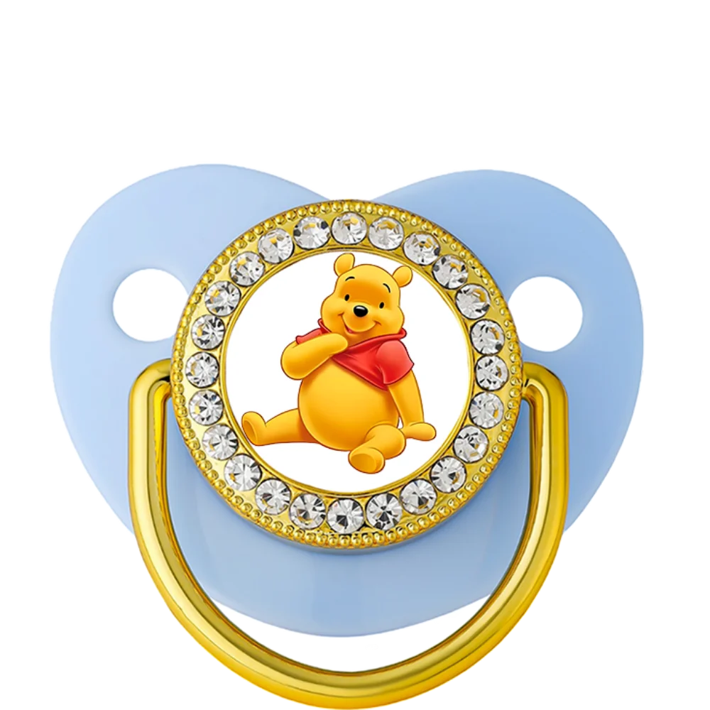 Blue silicone teething dummy with Winnie the Pooh design for baby teething relief.