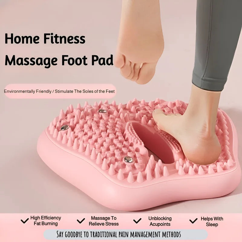 A person standing on a pink, triangular acupoint massage mat featuring rubber spikes and embedded magnetic stones.