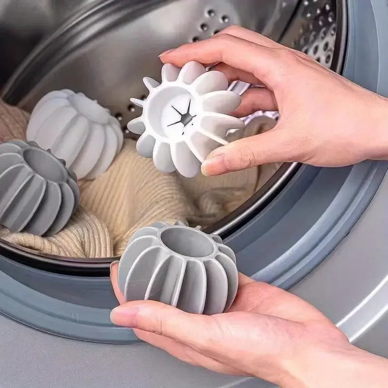 Reusable grey silicone laundry balls for removing pet hair from clothes in the washing machine.