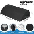Black ergonomic under-desk foot rest with memory foam, washable mesh cover, and non-slip base for office foot support.