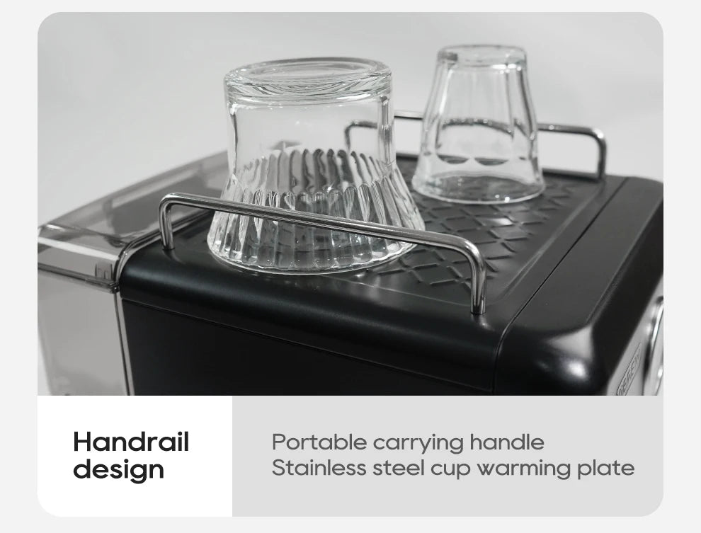 Black espresso machine with stainless steel cup warming tray, safety railing, and two glass cups on top.