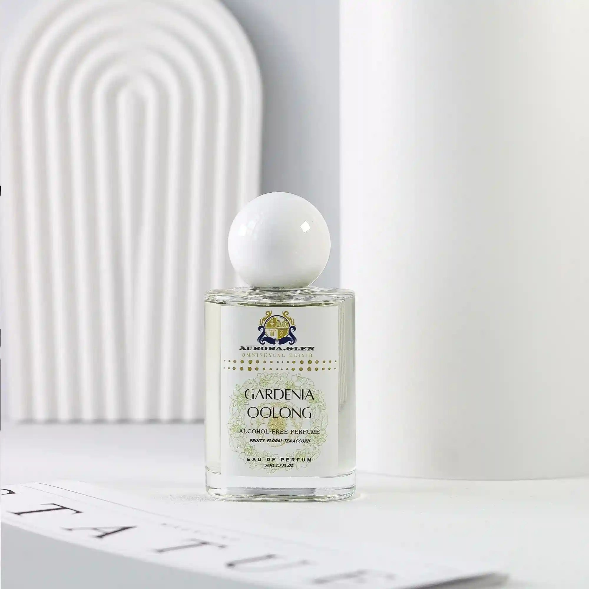 Aurora Glen Gardenia Oolong EDP perfume: unisex floral tea scent in a round-capped glass bottle for home fragrance.