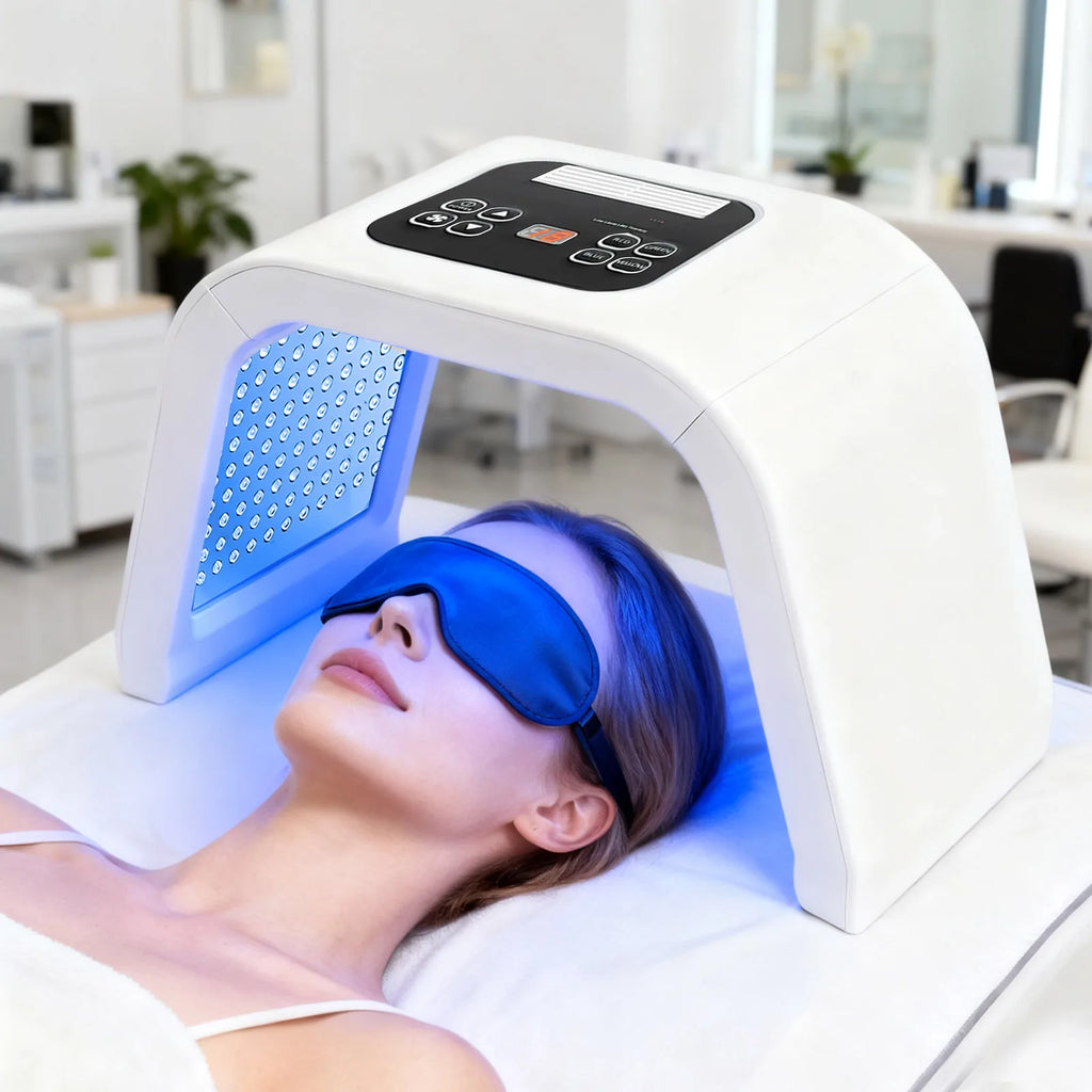 LED light therapy device with arch frame, digital control panel, and blue lights used for facial skin treatment.