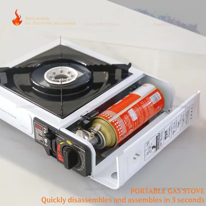 Portable gas stove with black burner grate and orange gas cylinder in open housing