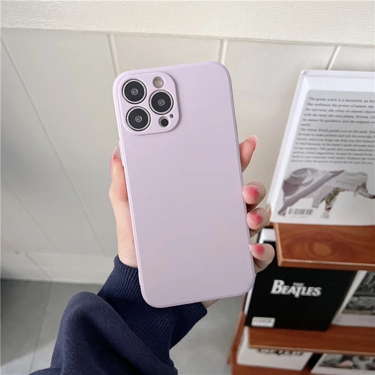 Matte light purple smartphone case for iPhone, rectangular with rounded corners, held in a hand.