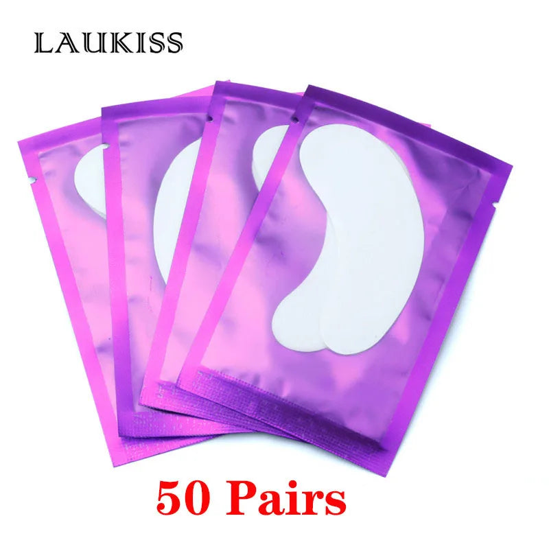 White lint-free under-eye gel patches for eyelash extensions in shiny metallic purple individual foil pouches.