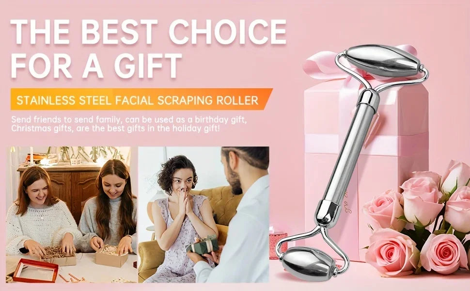 A polished stainless steel double-ended facial roller against a pink background with gift boxes and roses.